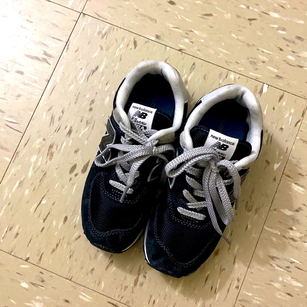 A navy blue gray and white new balance for toddlers size one in good condition